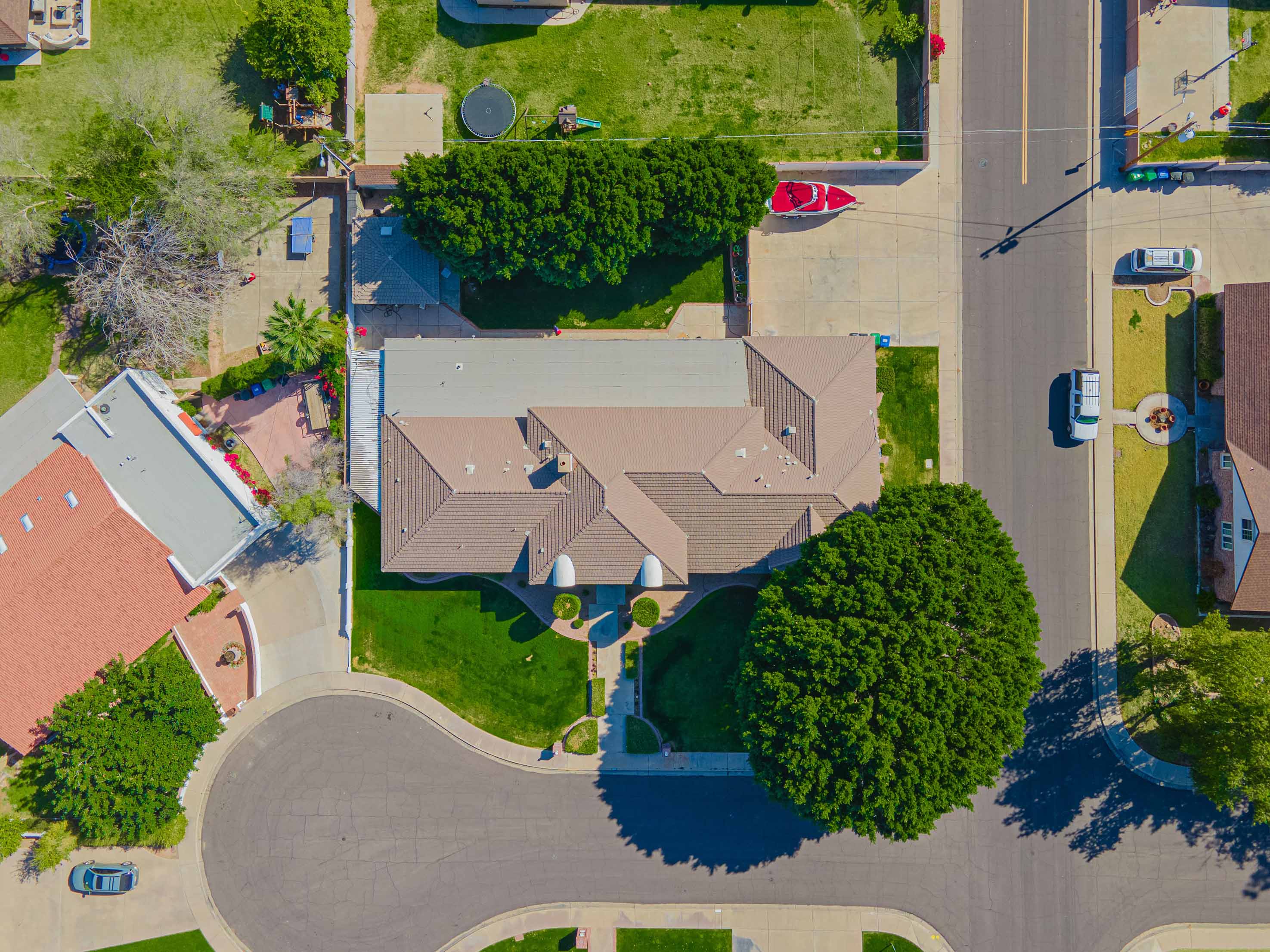 top-down aerial view of a home with a grassy lawn
